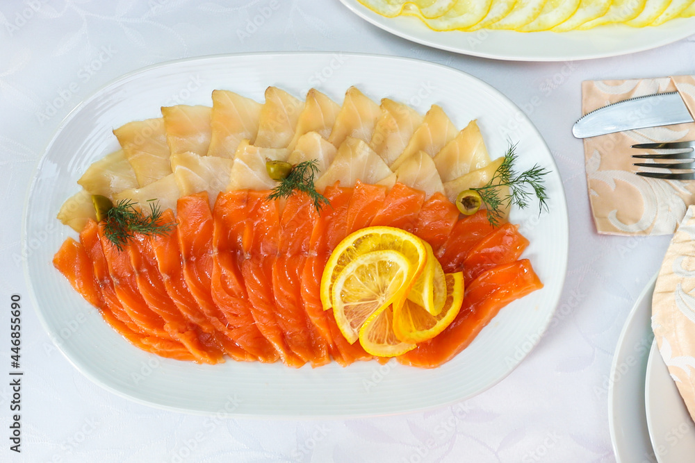 salt fish dish is on festive table top view close up. salt fish dish is on festive table top view close up.