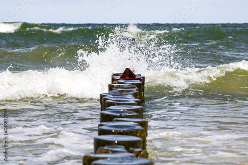 Obraz na płótnie Landscapes of Poland. Breakwater at Baltic sea. Wavy water. w salonie