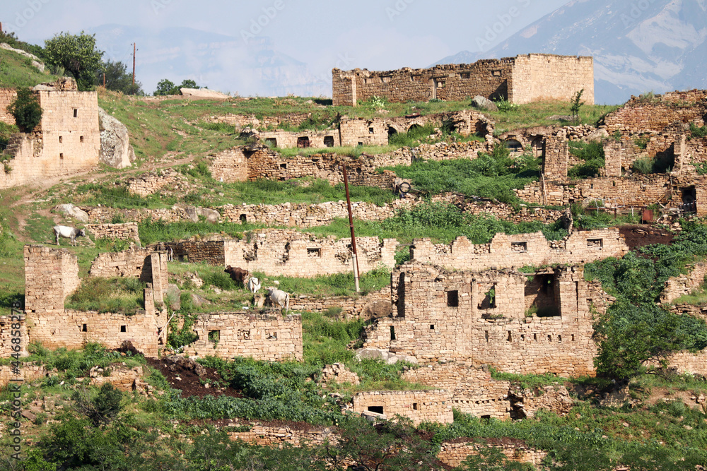 ruined stone houses of abandoned village Kurib in the mountains of Dagestan, Russia