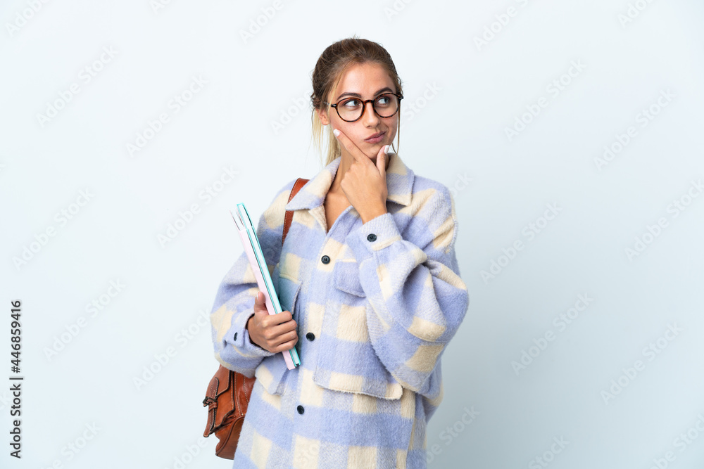 Young student woman isolated on white background thinking an idea while looking up Young student woman isolated on white background thinking an idea while looking up