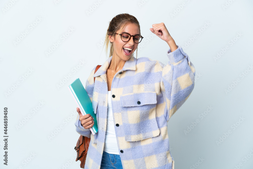 Young student woman isolated on white background celebrating a victory Young student woman isolated on white background celebrating a victory