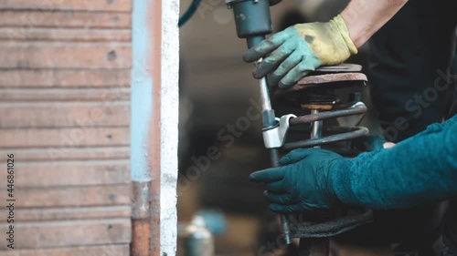 Wallpaper Mural car suspension repair, shock absorber spring dismantling. Torontodigital.ca