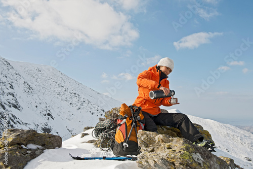 woman having a break on the way up to Mount Tryfan in north Wales photo