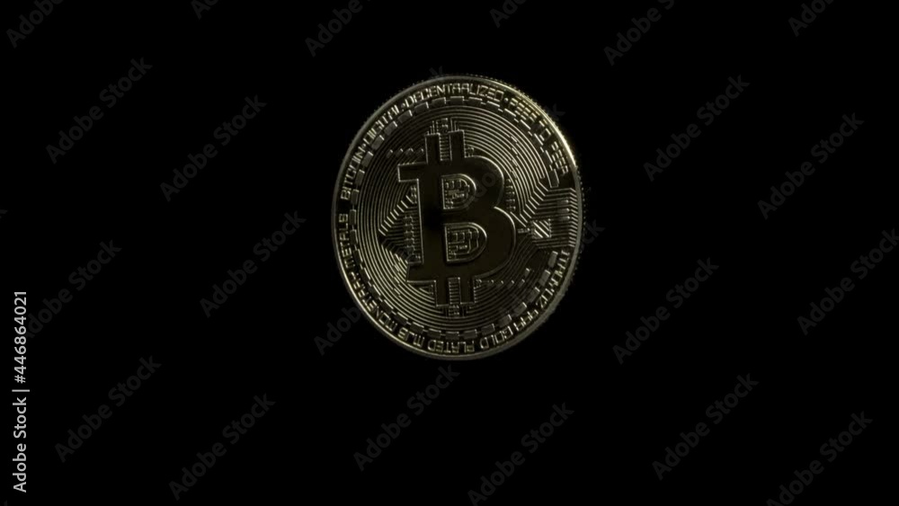 physical Bitcoin coin on a black background rotating slowly around. Virtual money. crypto currency. physical Bitcoin coin on a black background rotating slowly around. Virtual money. crypto currency.