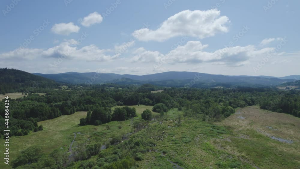 aerial view of a rural landscape with beautiful mountains on the horizon aerial view of a rural landscape with beautiful mountains on the horizon