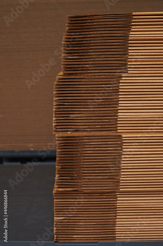Photography Stack of cardboard packaging folded in sheets in a factory.