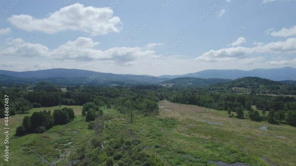 aerial view of a rural landscape with beautiful mountains on the horizon aerial view of a rural landscape with beautiful mountains on the horizon