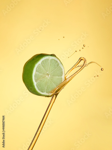 insulated lemon slice on a yellow background bathed in oil photo