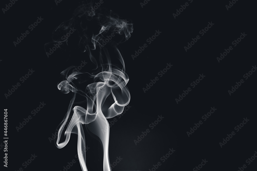 White smoke creating abstract shapes on a black background White smoke creating abstract shapes on a black background