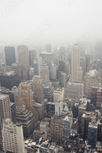 Aerial view of contemporary megapolis on misty day