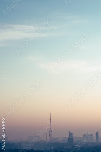 Radio tower on the morning cityscape
