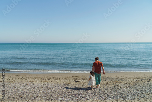 Father and daughter on the beach