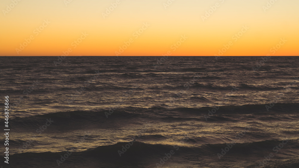Golden sunset over sea. clear sky with the horizon Golden sunset over sea. clear sky with the horizon