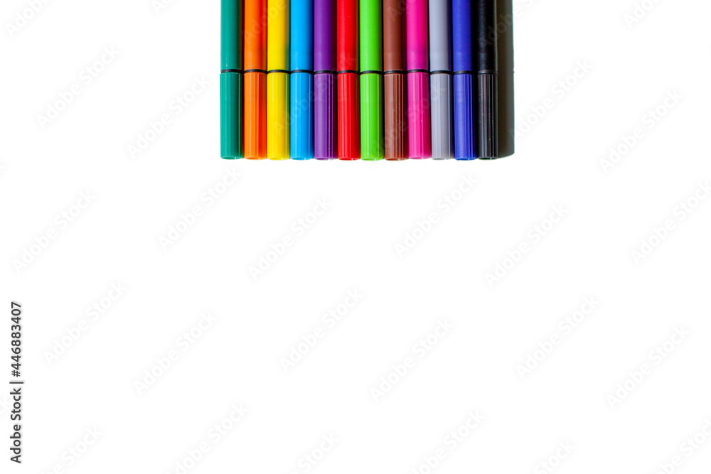 A set of colorful pens on a white background. Top view. 