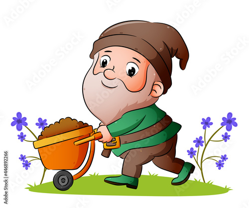 The dwarf is pulling the wheelbarrow with full of ground