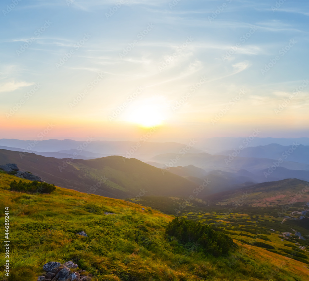 Fototapeta premium green mountain valley at the sunrise, travel mountain background