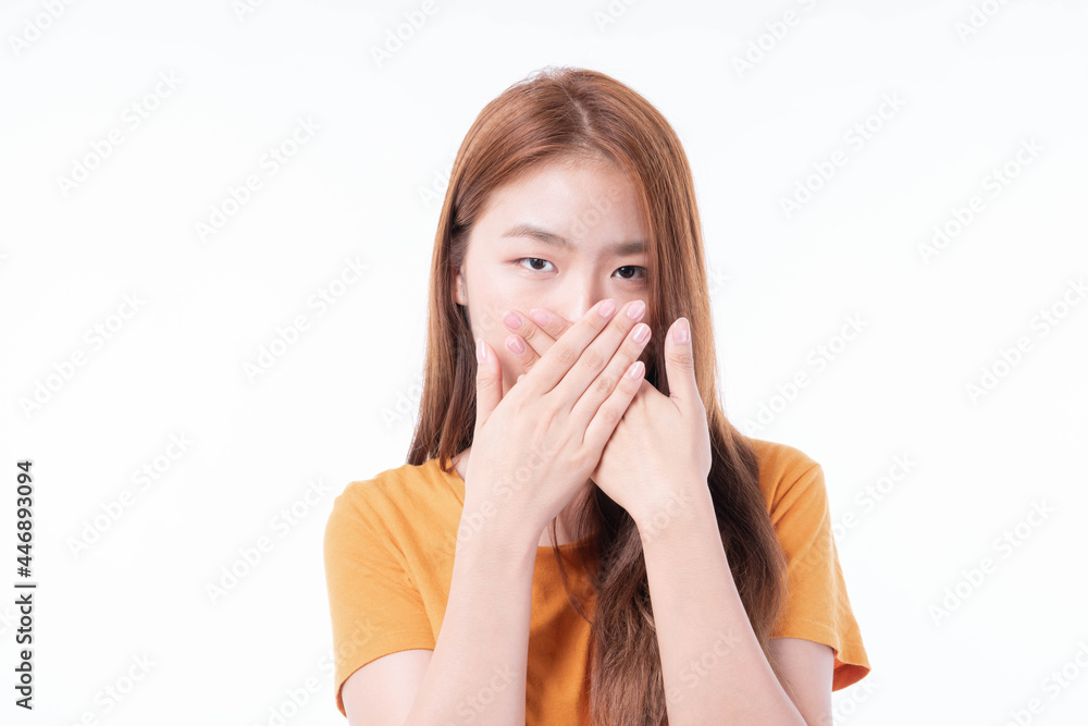 Asian girl used two hands closed covering his mouth for protection during the quarantine Coronavirus covid19 outbreak on white background , protect spread Covid-19 Asian girl used two hands closed covering his mouth for protection during the quarantine Coronavirus covid19 outbreak on white background , protect spread Covid-19