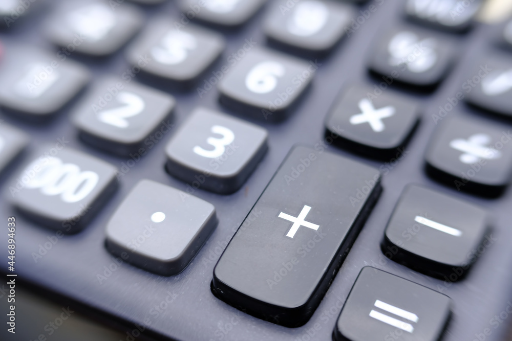 Close up calculator on wood table and macro calculator with number, business and finance concept Close up calculator on wood table and macro calculator with number, business and finance concept