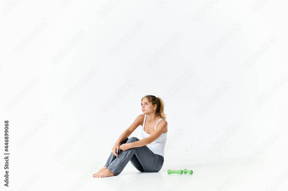 woman with dumbbells sitting on the floor exercise motivation workout woman with dumbbells sitting on the floor exercise motivation workout