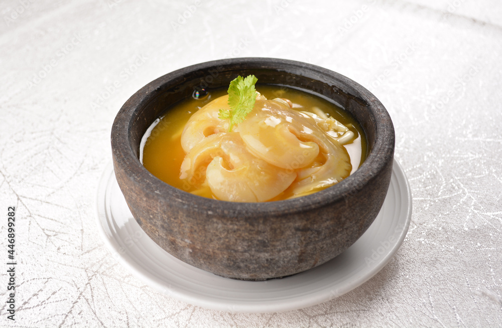 chinese superior double boiled premium shark's fin hot thick soup with crab, prawn and vegetable mushroom with herb in hot stone pot in white background asian halal seafood menu chinese superior double boiled premium shark's fin hot thick soup with crab, prawn and vegetable mushroom with herb in hot stone pot in white background asian halal seafood menu
