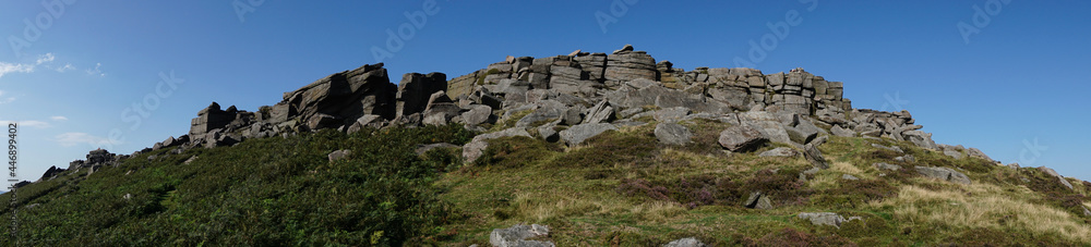 Cliffs of Stanage Edge in Derbyshire Peak District on bright sunny day