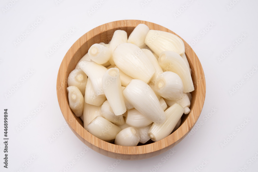 Top view of japanese shallots in wooden bowl. Healthy food Top view of japanese shallots in wooden bowl. Healthy food