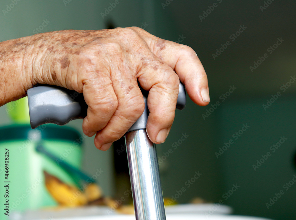 The old man used a cane to support his body. for uncle to walk in the ...