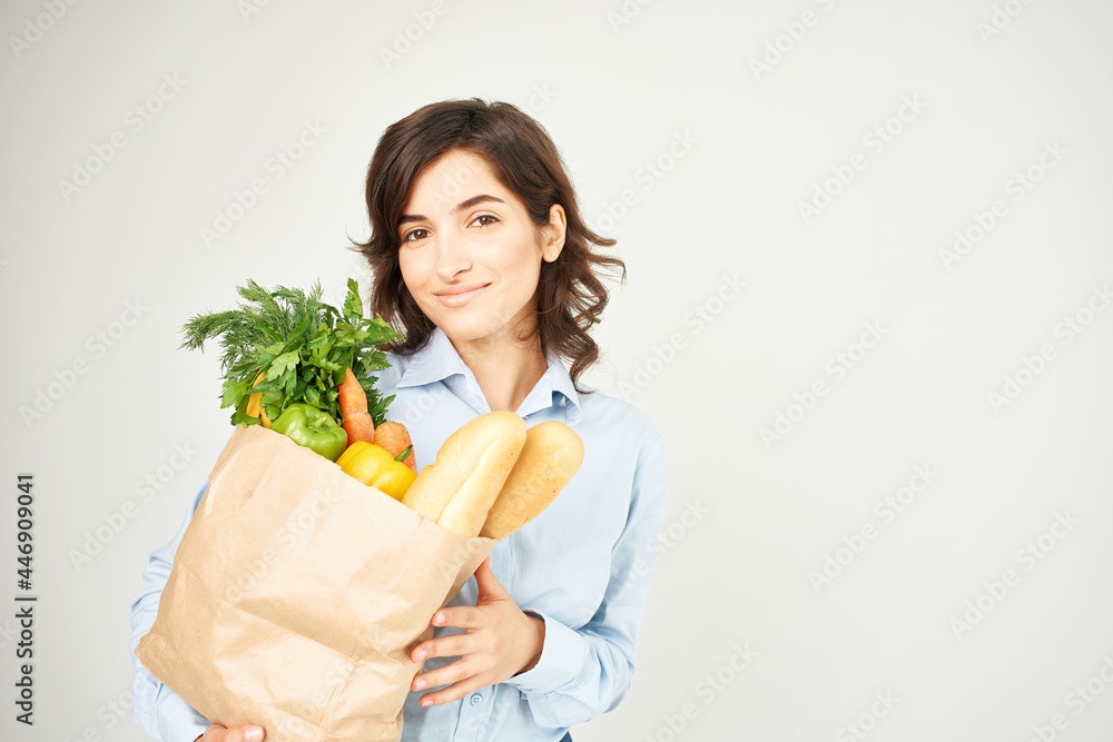 woman with paper bag of groceries supermarket lifestyle woman with paper bag of groceries supermarket lifestyle