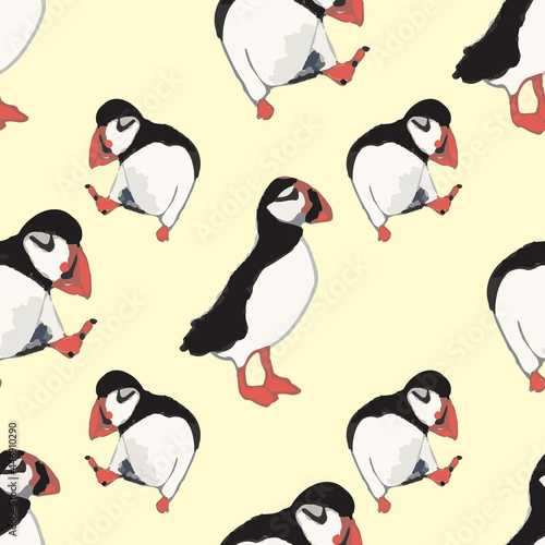 Vector yellow background ocean seabird, arctic birds, puffins. Seamless pattern background