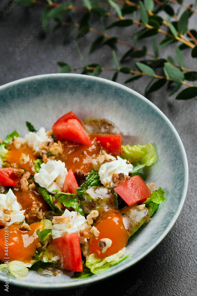 salad with fresh vegetables and peach closeup. Fresh Summer Salad with Peaches and Buratta Cheese. salad with fresh vegetables and peach closeup. Fresh Summer Salad with Peaches and Buratta Cheese.