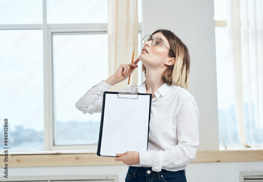Business woman in white shirt documents office Business woman in white shirt documents office