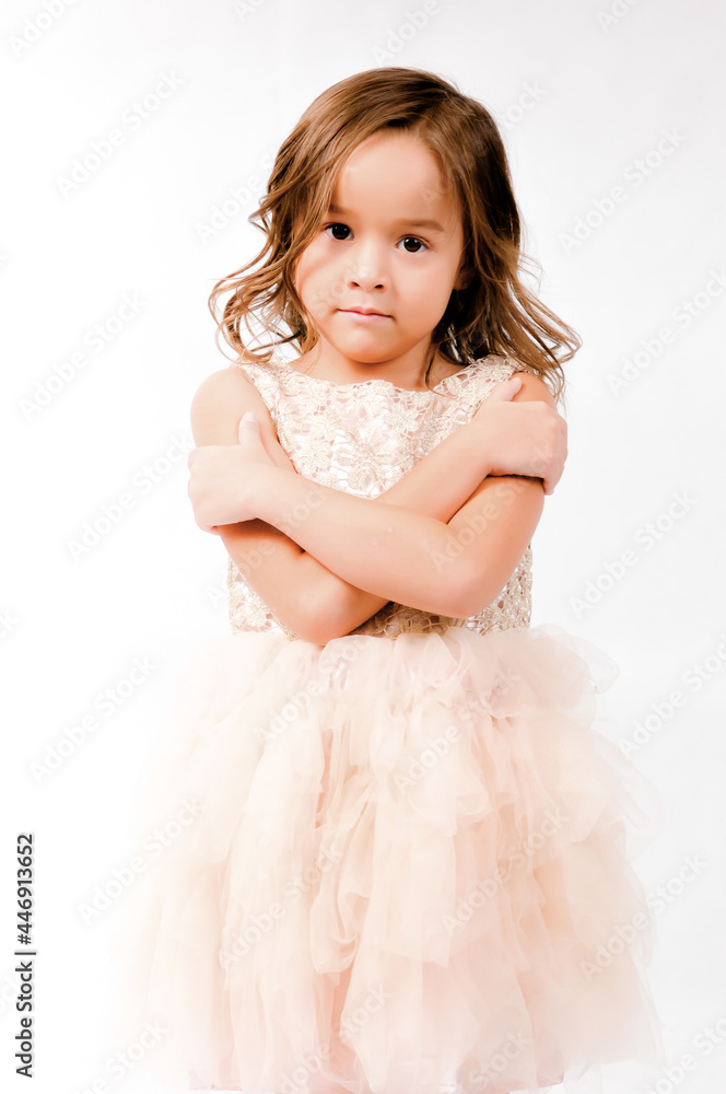 Portrait of happy pretty curly little girl standing and posing over white background Portrait of happy pretty curly little girl standing and posing over white background