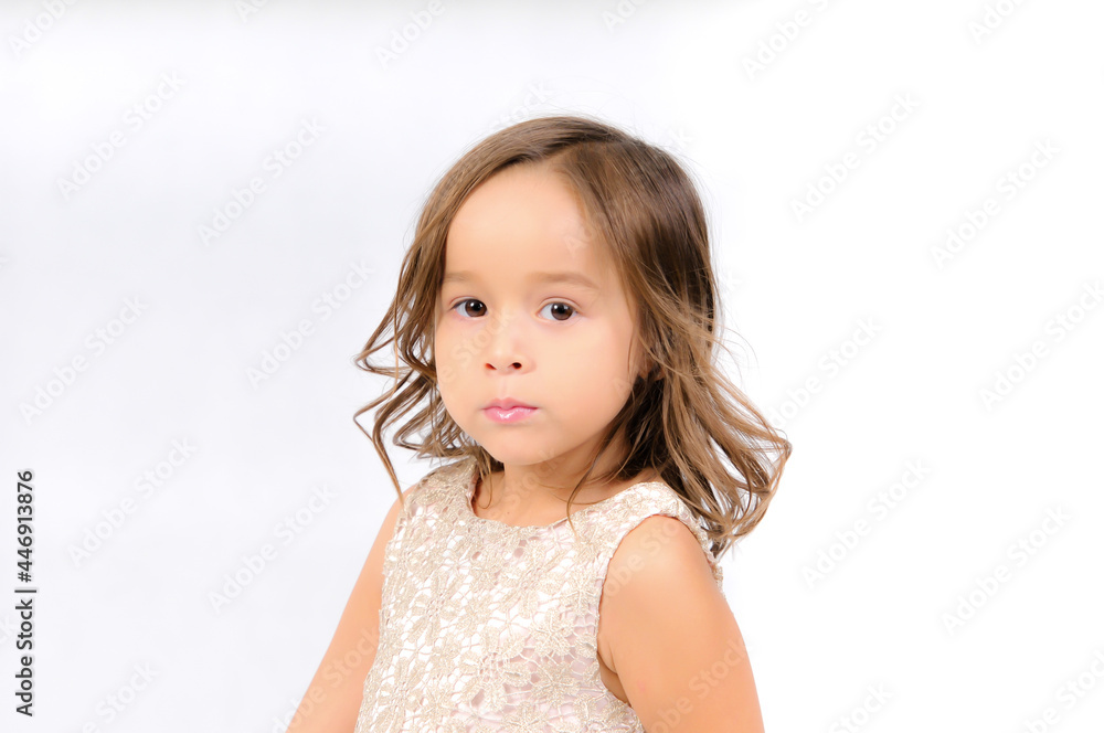 Portrait of happy pretty curly little girl standing and posing over white background Portrait of happy pretty curly little girl standing and posing over white background