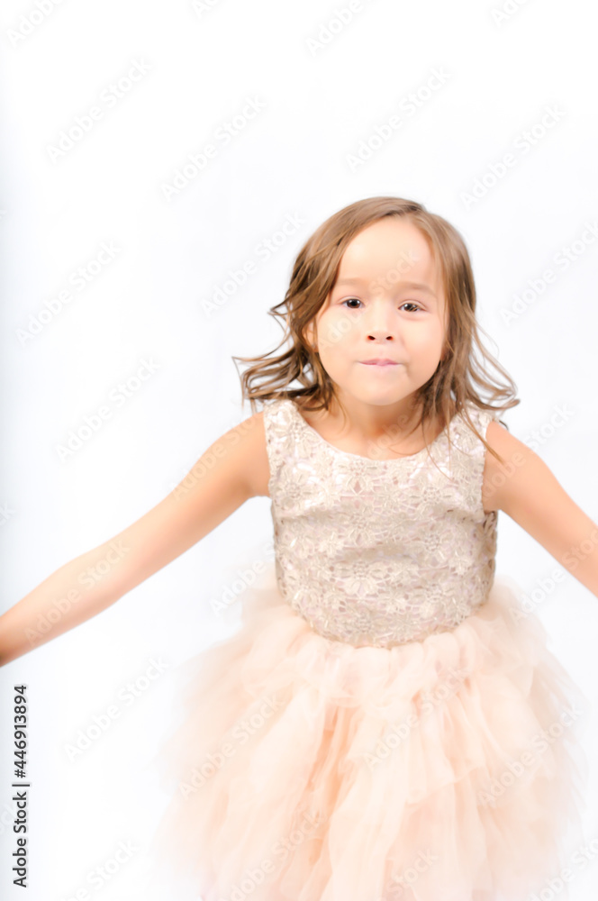 Portrait of happy pretty curly little girl standing and posing over white background Portrait of happy pretty curly little girl standing and posing over white background