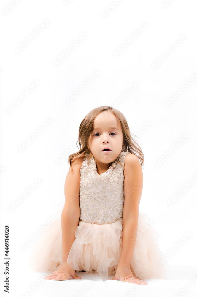 Portrait of happy pretty curly little girl standing and posing over white background Portrait of happy pretty curly little girl standing and posing over white background