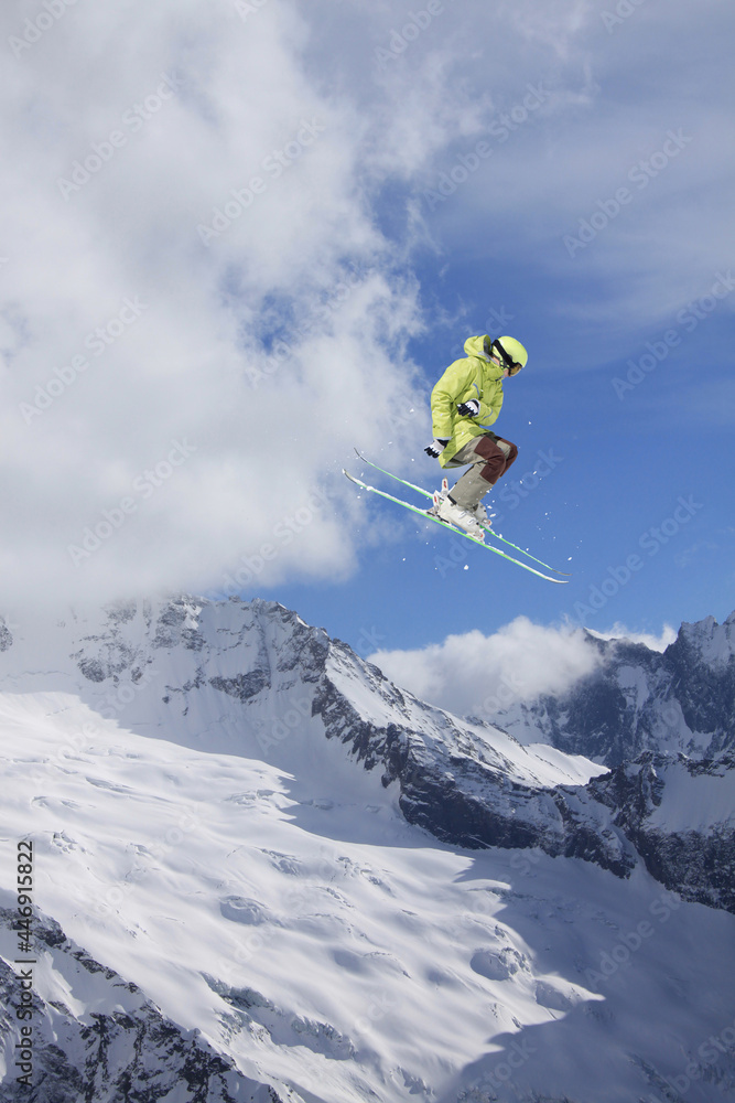 Flying skier on mountains. Extreme winter sport. Flying skier on mountains. Extreme winter sport.
