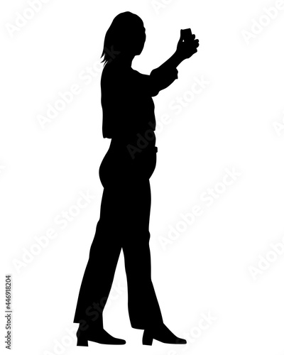 Young woman holds a smartphone in her hand. Isolated silhouettes of people on a white background