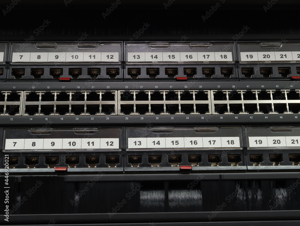 An Ethernet switch and patch panels installed in a low-current rack.