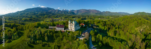 Pilgrimage church St. Anne in Tunjice and in background Kamnik - Savinja Alps, Slovenia