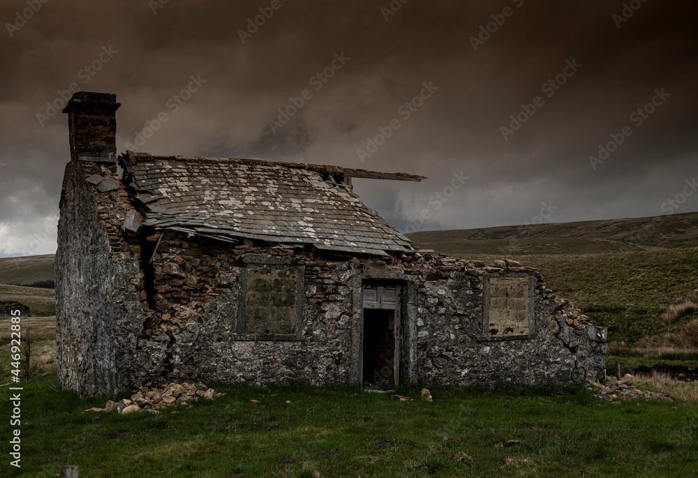 ruined barn at dusk with heavy sky in North Yorkshire