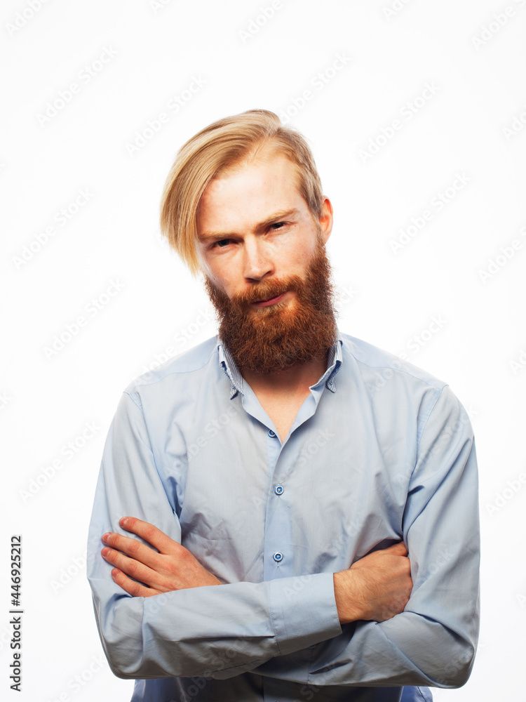 Lifestyle and people concept: Young bearded guy crossing his arms Lifestyle and people concept: Young bearded guy crossing his arms