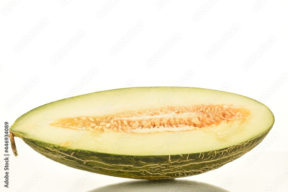 One half of juicy organic melon, close-up, isolated on white. One half of juicy organic melon, close-up, isolated on white.