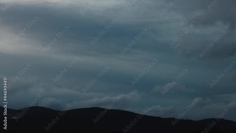 timelapse of sunset turning to night and clouds rolling over the mountains and thick vegetation shot in Tasmania, Australia timelapse of sunset turning to night and clouds rolling over the mountains and thick vegetation shot in Tasmania, Australia