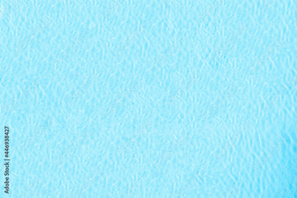 Blue transparent water surface in the swimming pool. Horizontal pool background. Aerial, drone view Blue transparent water surface in the swimming pool. Horizontal pool background. Aerial, drone view