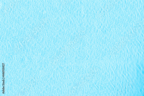 Blue transparent water surface in the swimming pool. Horizontal pool background. Aerial, drone view