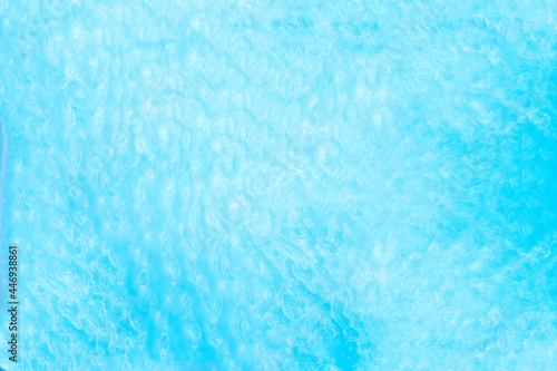 Blue transparent water surface in the swimming pool. Horizontal pool background. Aerial, drone view