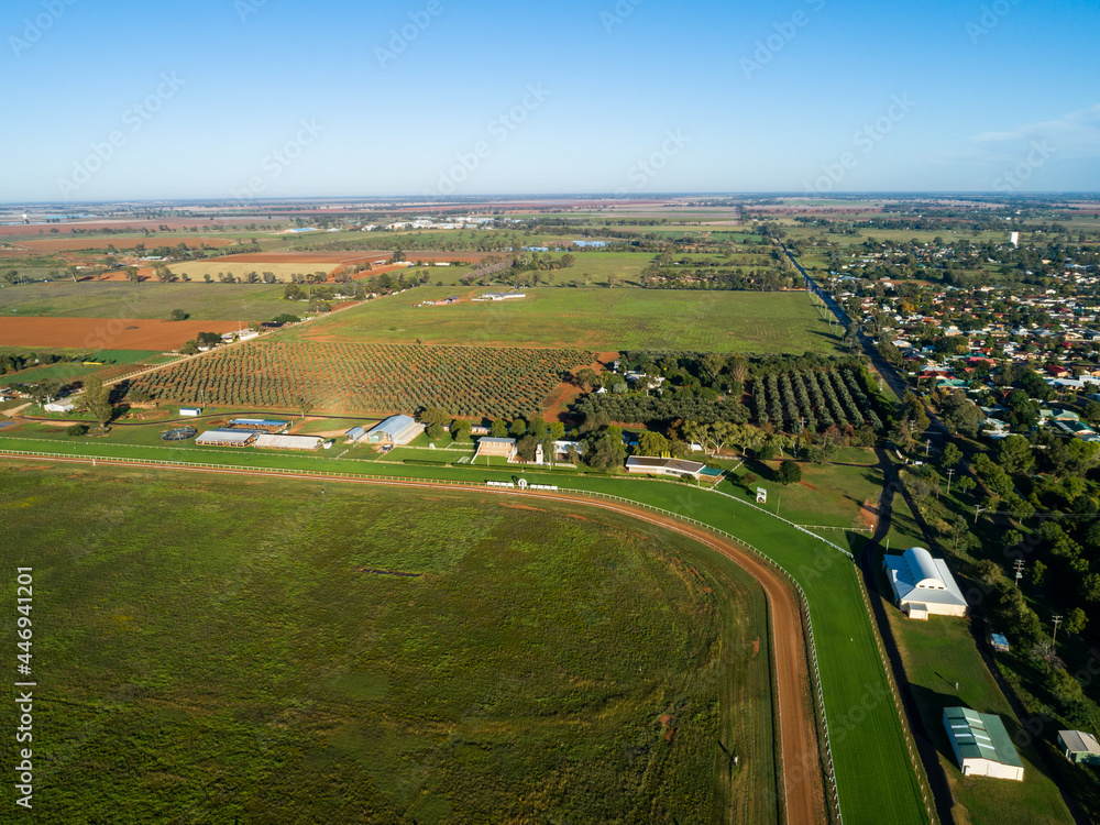 Empty country showground oval and racecourse seen from the air on sunlit day Empty country showground oval and racecourse seen from the air on sunlit day