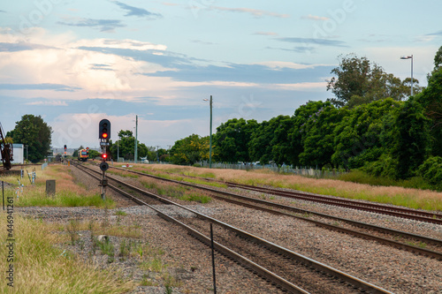 Distant train switching rails to coming into the station
