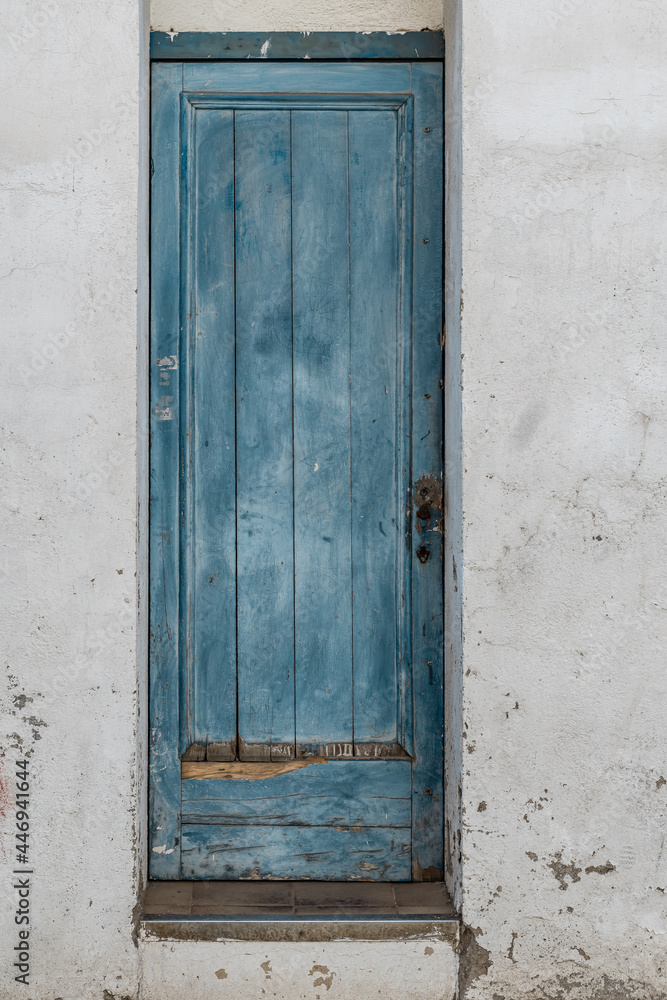 Rustic blue wooden door of a rural house