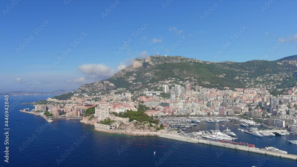 Monte Carlo, Monaco. Aerial view of famous city towering over Mediterranean Sea, yachts and boats in marina Port Hercules in La Condamine - landscape panorama of Europe from above Monte Carlo, Monaco. Aerial view of famous city towering over Mediterranean Sea, yachts and boats in marina Port Hercules in La Condamine - landscape panorama of Europe from above